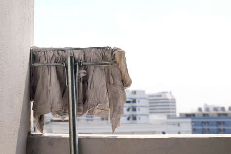 mop cloth white dirty for wiping, mop for cleaning floor, mop head at wall after cleaning, mop cleaning cloth in the air and sun to make them dry outの写真素材