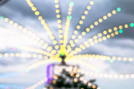 blur decorative lights bokeh colorful for background, decorative string lights outdoor at night timeの写真素材