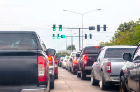 blurred car traffic jam on the road urban, busy cars driving in hour traffic jamの写真素材