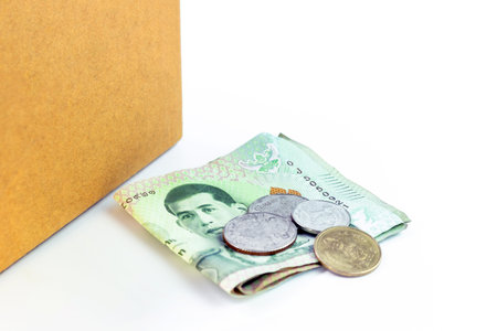money banknote thai baht near the parcel post box, money and cardboard box for shipping service...
