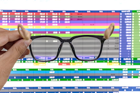 glasses on computer screen, glasses for eyesight and work hard conceptの写真素材