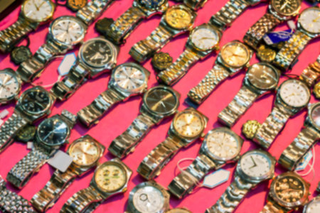 Blurred watch wrist in shop for background, Clock blur imageの写真素材