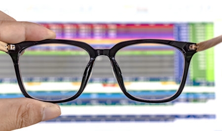 glasses on computer screen, glasses for eyesight and work hard conceptの写真素材