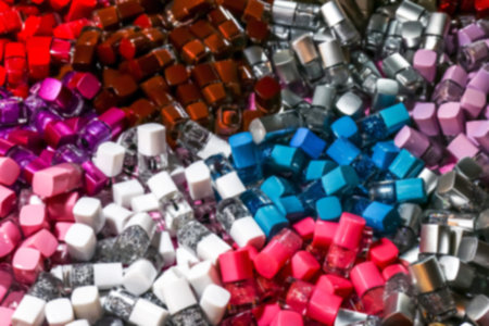 blurred nail polish bottle pile for background