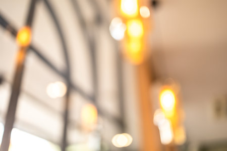 blurred bokeh lighting in restaurant, bokeh light in coffee shop for backgroundの写真素材
