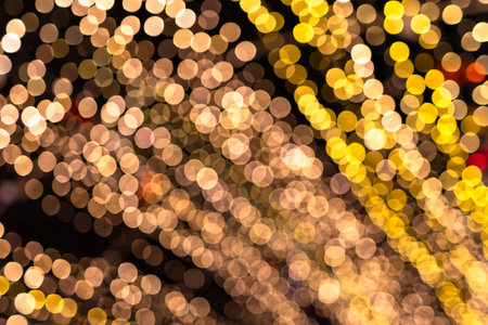 bokeh gold for xmas background, glowing colorful abstract wallpaper, christmas backgroundの写真素材