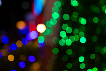 christmas background, bokeh green sparkle for xmas background, glowing colorful abstract wallpaperの写真素材