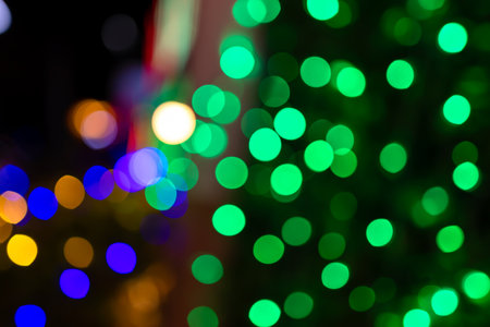 christmas background, bokeh green sparkle for xmas background, glowing colorful abstract wallpaperの写真素材
