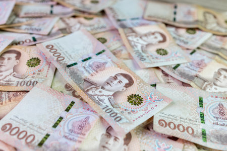 thai money banknote baht for background, pile of one thousand thai baht banknotes, savings money and financial business conceptの写真素材