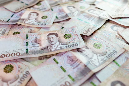 thai money banknote baht for background, pile of one thousand thai baht banknotes, savings money and financial business conceptの写真素材