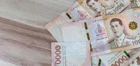 thai money banknote baht for background, pile of one thousand thai baht banknotes, savings money and financial business conceptの写真素材