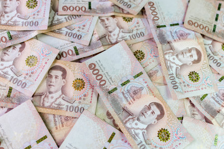 thai money banknote baht for background, pile of one thousand thai baht banknotes, savings money and financial business conceptの写真素材