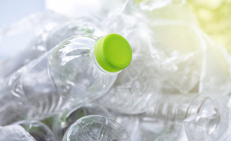 plastic waste, clear bottles in a trash bag, reflecting the plastic waste issue, represents recycling, waste separation, its environmental impact, plastic recyclingの写真素材