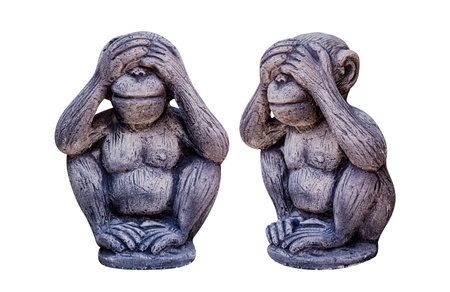 Monkey statue isolated on white, Monkey statue covering their eyes, symbolizing of see no evil, a...