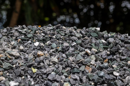 Construction stones used for cement mixing, Rock, Stone pile, Ideal for illustrating engineering or infrastructure projectsの写真素材