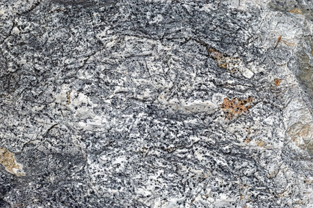 Rough gray stone texture with natural pores and detailed patterns, offering a raw and organic look,...