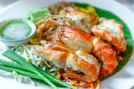 Prawn Pad Thai, close-up. Pad Thai with grilled river prawns, stir fried noodles in rich sauce...