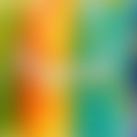 A vibrant, blurred gradient background showcases a spectrum of colors including green, orange, yellow, and blue, creating a lively effect.の写真素材