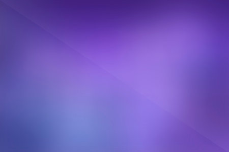 A vibrant, blurred background featuring a smooth gradient of deep purple and blue, bisected by a faint diagonal line.の写真素材