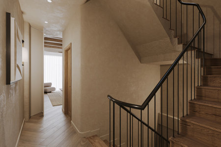 A duplex residential features a staircase made of hardwood and stainless steel railing.の写真素材