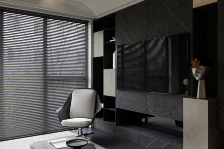 A white and black armchair setting by the TV wall mounted in a modern living.の写真素材