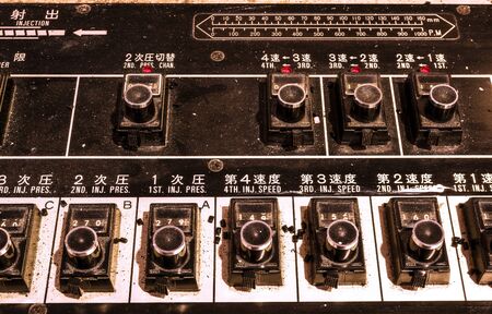 Chinese old and dirty control panel in factoryの写真素材