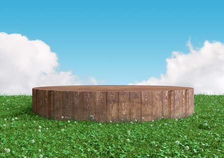 Round wood podium, pedestal or stand display on summer landscape with green grass and blue sky. Realistic 3d illustration. Abstract nature composition.の写真素材