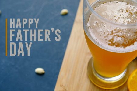 Happy father's day graphic with pint of beer and snacking peanuts in background.  Text for holiday...
