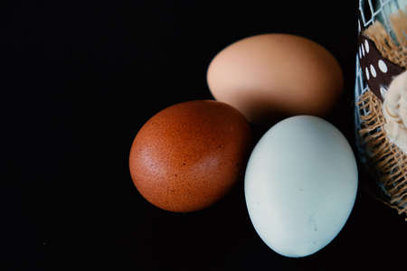 Farm fresh eggs from chicken shows natural healthy food close up with copy space.の写真素材