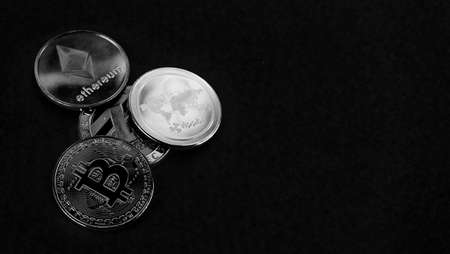 Black and white image of cryptocurrency coins with copy space for business concept.の写真素材