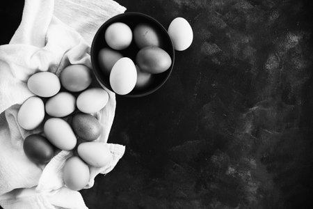 Closeup of chicken eggs top view in black and white with copy space for farm fresh ingredient concept.の写真素材