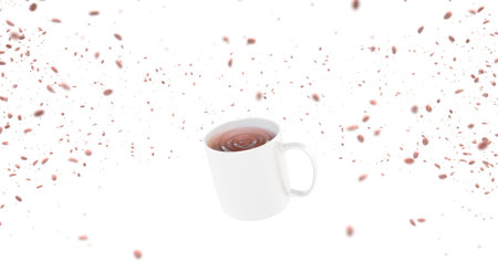 Cup of tea with falling cherry petals isolated on white backgroundの写真素材