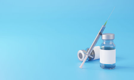 Blank white label on injection bottle glass vial with syringe against a blue background.Copy space...