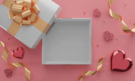 Open gift box with gold bow and confetti. 3D renderingの写真素材