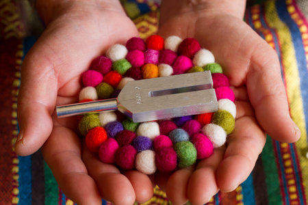 tuning fork and crystal on table.の写真素材