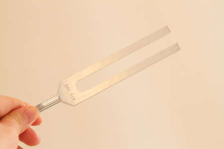 tuning fork and crystal on table.の写真素材