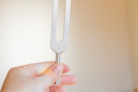 tuning fork and crystal on table.