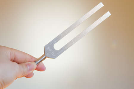 tuning fork and crystal on table.の写真素材