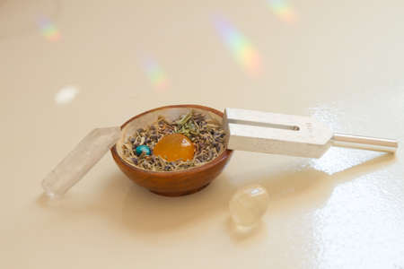 tuning fork and crystal on table.の写真素材