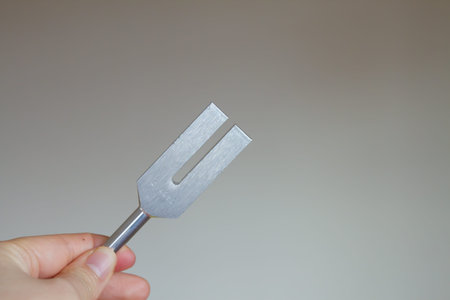 tuning fork and crystal on table.