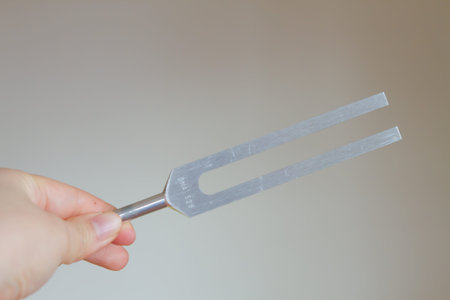 tuning fork and crystal on table.