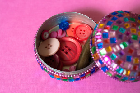colorful indian box on pink table.