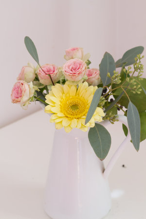 flower arrangement in white enamel .の写真素材