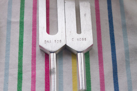 tuning fork and crystal on table .