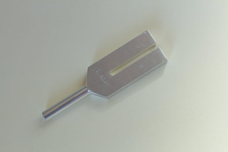 tuning fork and crystal on table .