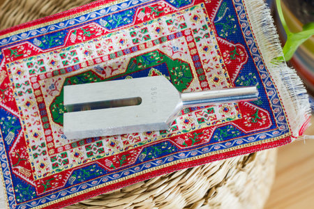 tuning fork and crystal on table .