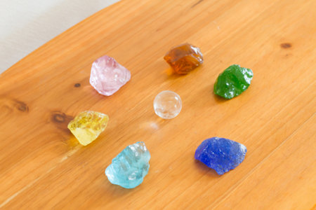Healing crystal stone on a wooden table.