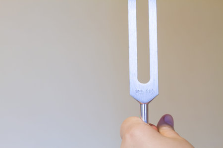 tuning fork and candles on table.