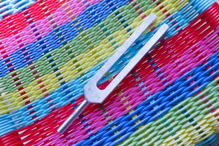 tuning fork and crystal on table.