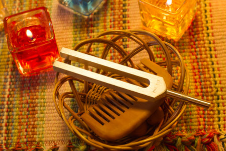 tuning fork and crystal on table.